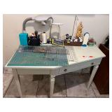 Laundry… Angled one drawer desk, this piece was used for a sewing desk, comes with assorted accessories to include desk lighting, cutting mat, rulers, and much more. See pictures for details.