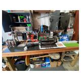 Content of shop bench and two cabinets, content only, items include a timing light, Cabela’s commercial vacuum sealer, cordless drills, small diecast cars in original packaging, oscillating floor fa