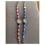 2 BOUCHE BRACELET WATCHES (1 W/ PINK GLASS CAT EYES, 1 W/ BLUE GLASS CAT EYES - MISSING 1 STONE) - CHECKOUT