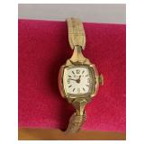VINTAGE LADIES PETITE BULOVA WATCH WITH 10K GOLD BEZEL & 10K GOLD FILLED BAND - CHECKOUT