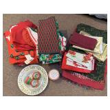 SHELF LOT OF MISC CHRISTMAS PLACEMATS, TABLECLOTHS, NAPKINS & MORE