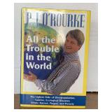 1994 FIRST EDITION "ALL THE TROUBLE IN THE WORLD" HARDBACK BOOK