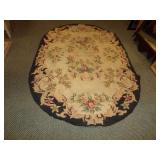 VINTAGE OVAL AREA RUG WITH FLORAL PATTERN
