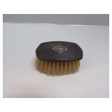 ANTIQUE BRUSH WITH STERLING SILVER HANDLE