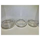 KIT...Small clear glass nesting bowls, two pieces, also includes a small Pyrex casserole/refrigerator dish with lid, see pictures for details.