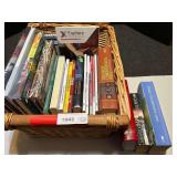 Book assortment with large woven basket, see pictures for details.