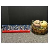 Home decor to include a woven basket with metal accents, and freedom plaque. See pictures for details.