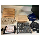 KIT...Assorted trivets, approximately seven pieces, also includes a small enamel metal mini simmering pot, see pictures for details.