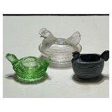 Small glass nesting hen, green glass hen candle holder, and ceramic hen. Three pieces total, see pictures for details.