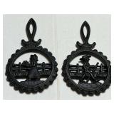 Small, cast-iron trivets, set of two, see pictures for details.