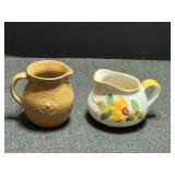 Vintage small pitchers to include artisan pottery from the Meador family, two pieces total, see pictures for details.