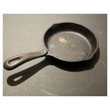DR… Wagner’s small cast-iron skillet, see pictures for details.