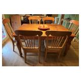 DR… Rectangular solid wood dining table with geometric inlay design, has six spindle back chairs, farmhouse look, see pictures for details.