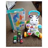 Mixed Toy Lot: Mega Bloks, Toy Trucks, and Walker