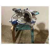 Kobalt 10 inch compound miter, with stand, powers up, see pictures for details.