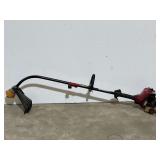 Troy Bilt weedeater, not locked up, working condition unknown, see pictures for details.
