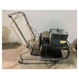 Factory Cat industrial battery charger, believed to be for a golf cart, does not power up. comes with a welding stand mounted on a shopping cart frame, see pictures for details.