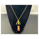 Gold-tone Joan Rivers Classics Collection Fabergé-style egg pendant necklace with red crystals, topped with a crown and Fabergé-style pendant, see pictures for details.