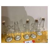 Small glass storage bottles, with handles, set of five, see pictures for details.