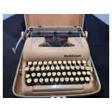 Vintage Smith Corona manual typewriter with storage case, see pictures for details.