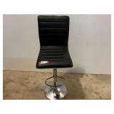 Black faux leather and chrome adjustable swivel bar stool. See pictures for details.