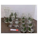 Lovely Christmas tree holiday glassware with gold trim, includes stemware, carafe, and highball glasses. Approximately 15 pieces total, see pictures for details.