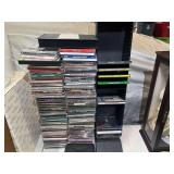 Large CD assortment, and more. Comes with CD display stand, see pictures for details.