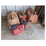 GAS CANS IN GARAGE CORNER FLOOR AREA MARKED 9002, FIVE UNITS