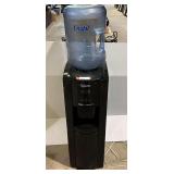 Regalta hot and cold water dispenser, powers up, working condition unknown, see pictures for details.