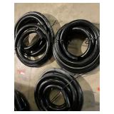 Flexible hose, approximately 1 3/4” O. D., and approximately 30’ total. See pictures for details.