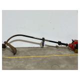 Homelite weedeater, not locked up, working condition unknown, see pictures for details.