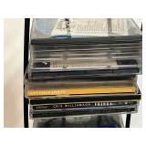 CD display stand with assorted CDs, see pictures for details.