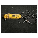 Dewalt DW 400 4 1/2” angle grinder, powers up, working condition unknown, missing abrasive disc and safety guard, see pictures for details.