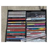 Assorted CDs and storage case, see pictures for details.