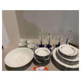Lovely Noritake China, includes plates, salad plates, cups and saucers, and bowls, also comes with a white serving bowl, also includes Luminarc stemware, approximately 33 pieces total, see pictures fo