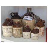 VINTAGE SMALL POTTERY CROCK JUGS WITH ADVERTISING PLUS VINTAGE JIM BEAM COLLECTIBLE DECANTER