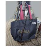 PURSES AND BAGS HANGING ON BACK OF WIRE FRAME CART