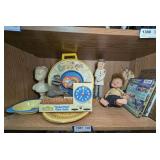 VINTAGE SESAME STREET COOKIE TIME CLOCK RADIO, BARNEY BOWL, DICK TRACY, AND MORE ON SHELF MARKED 1381