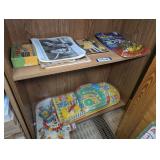 BLACK AND WHITE HOLLYWOOD PHOTOGRAPHS, VINTAGE PINBALL GAMES, AND MORE ON TWO BOTTOM SHELVES MARKED 1387