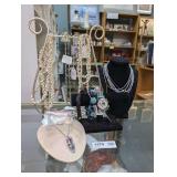 JEWELRY AND JEWELRY STANDS IN COUNTERTOP AREA MARKED 1570