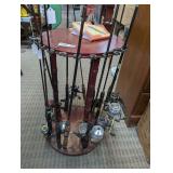 FISHING ROD STAND WITH VINTAGE RODS AND REELS INCLUDING ZEBCO, ABU GARCIA, QUANTUM, AND MORE