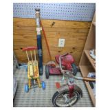 VINTAGE AMF TRICYCLE, PLAYSKOOL GIRAFFE CART, OLD METAL ROLLING NOISE MAKER, AND VINTAGE SOFTBALL BAT