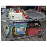 CONTENTS OF TWO SHELVES MARKED 1653 INCLUDING WINTER MOTIF LARGE GLASS PLATTER BOWL, KITCHEN UTENSILS, SOCCER/BASKETBALL/BASEBALL MOTIF COAT HANGER SHELF, 1939 BOOK, AND MORE