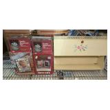 MID-CENTURY HANGING BATHROOM ORGANIZER WITH TOWEL HOLDER, VANITY MANICURE SETS IN ORIGINAL BOXES, PHOTO CLOCK IN ORIGINAL BOX, AND SILVER PLATED BABY PHOTO ALBUM IN ORIGINAL BOX