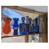 VINTAGE GLASS AND DECANTERS IN SHELF AREA MARKED 1005
