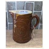 ANTIQUE COW MOTIF GLAZED POTTERY CROCK PITCHER