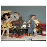 VINTAGE BUDWEISER AND GUINNESS BEER CLOCKS, COLLECTIBLE DOLLS, CAST IRON NUTCRACKERS, AND MORE ON TOP OF CABINET MARKED 1501