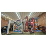 ALL STAR WARS ACTION FIGURES, DECANTERS, AND MORE ON TOP OF GREEN BOOKCASE