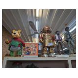 VINTAGE TOYS AND CHALKWARE COWBOY FIGURINES ON TOP OF BOOKCASE MARKED 1200