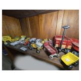 RADIO FLYER WAGON MINIATURES, HEAVY DIECAST MURRAY PEDAL TRACTOR MODEL, DIECAST CUB CADET MODEL, HALLMARK DIECAST PEDAL CAR MODELS, AND MORE ON SHELF MARKED 1495
